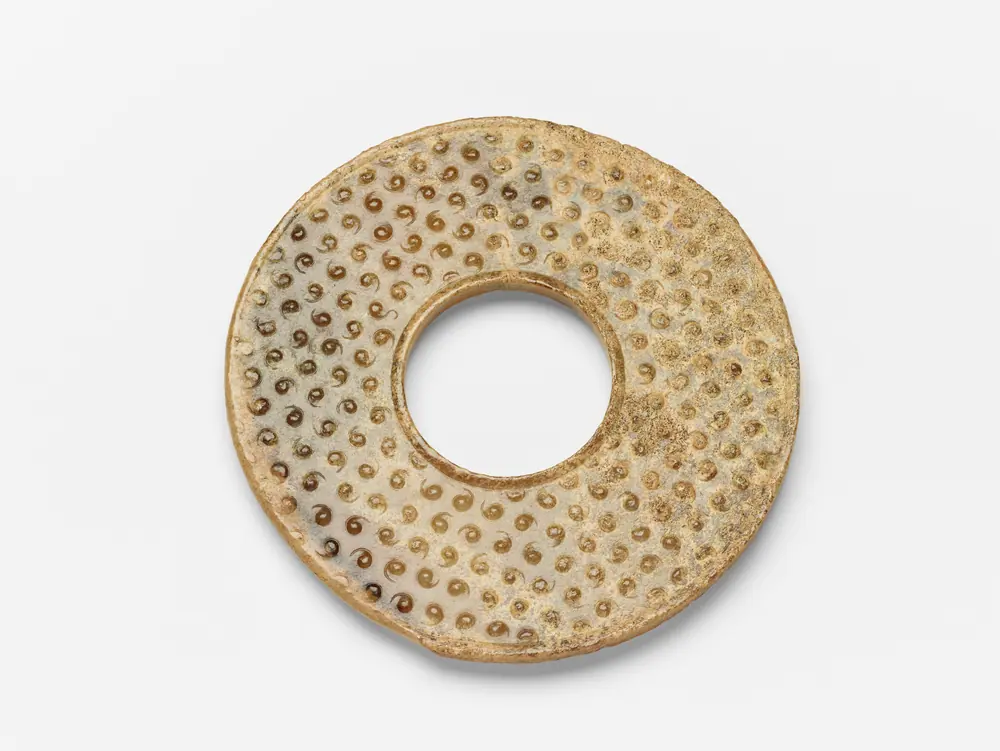 Disk (bi) with raised uniform curls arranged in a grid — Disk (bi) with raised uniform curls arranged in a grid